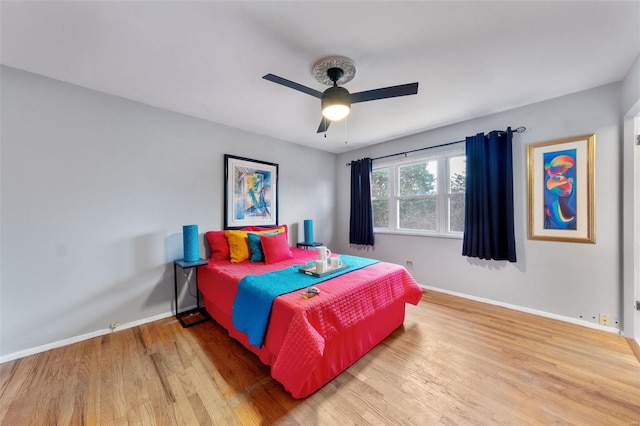 bedroom featuring ceiling fan and hardwood / wood-style flooring