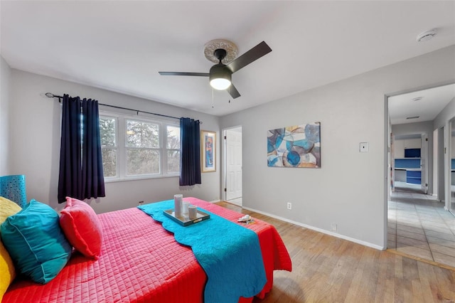 bedroom featuring ceiling fan and light hardwood / wood-style flooring