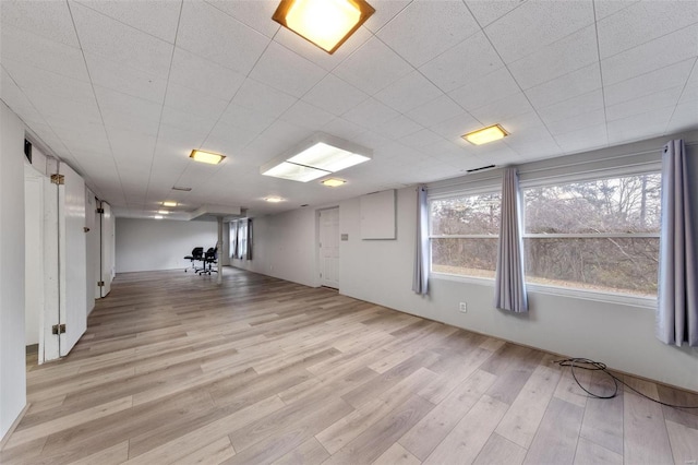 basement featuring light hardwood / wood-style floors