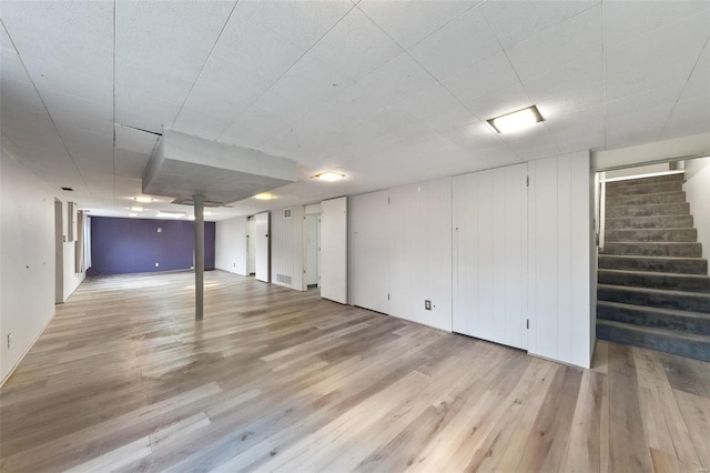 basement featuring light wood-type flooring