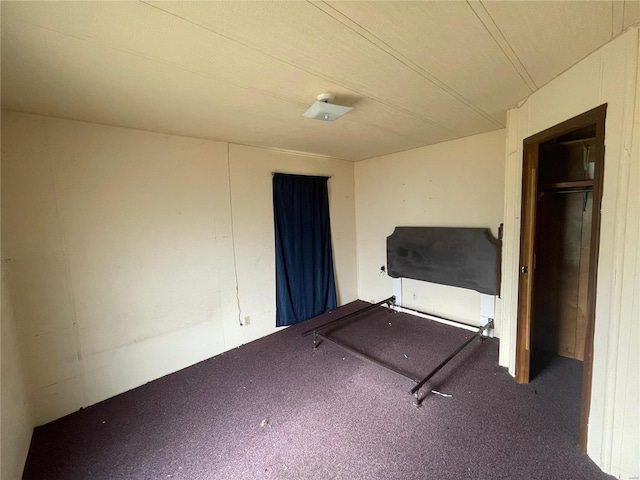 unfurnished bedroom with carpet flooring