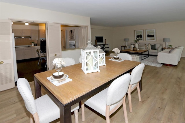 dining area with light hardwood / wood-style flooring