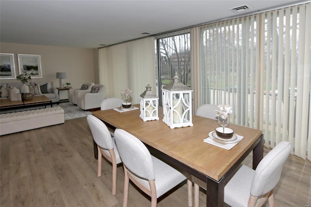 dining area featuring hardwood / wood-style floors