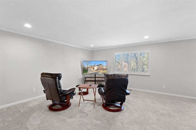 sitting room featuring light colored carpet and ornamental molding