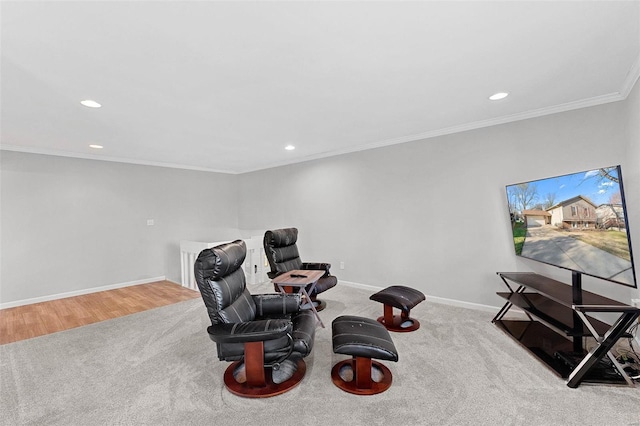 living area featuring light colored carpet and ornamental molding