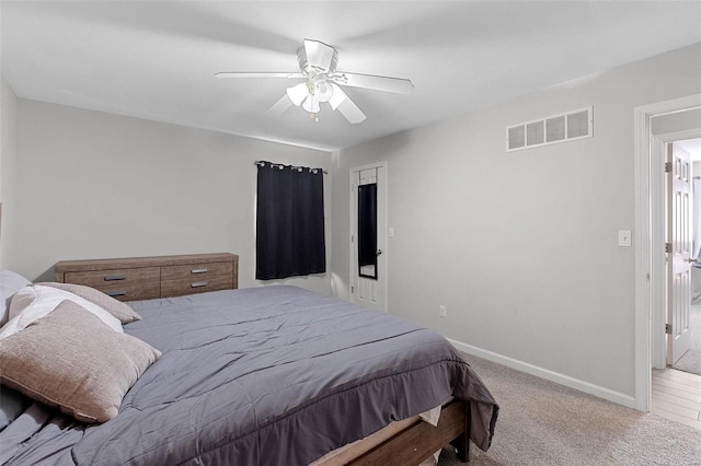 bedroom featuring ceiling fan and light colored carpet