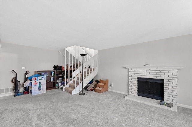 carpeted living room with a fireplace