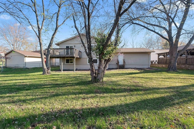 view of front of home featuring a front yard and a wooden deck