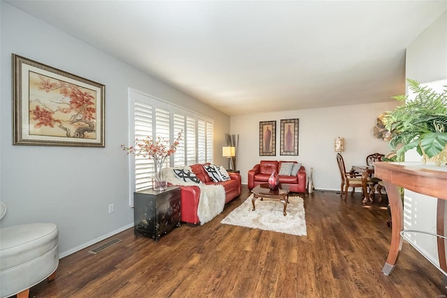 living room featuring dark wood-type flooring