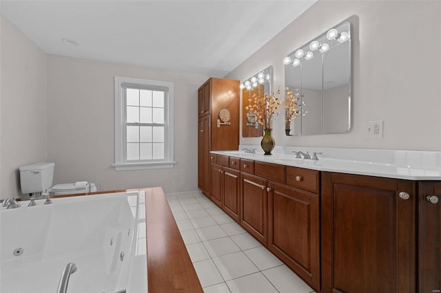 bathroom with double vanity, a sink, tile patterned flooring, and a whirlpool tub