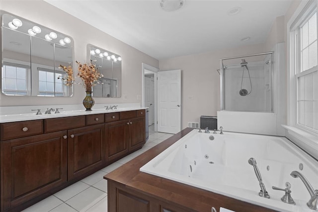 full bathroom with visible vents, a stall shower, a whirlpool tub, a sink, and tile patterned floors