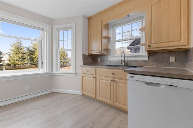 kitchen with tasteful backsplash, light brown cabinetry, light wood-type flooring, white dishwasher, and a sink