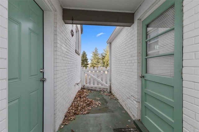 exterior space with brick siding and fence