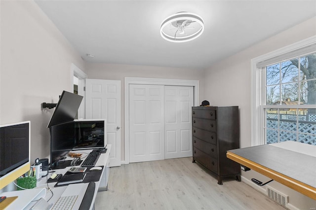 home office featuring light wood-style floors