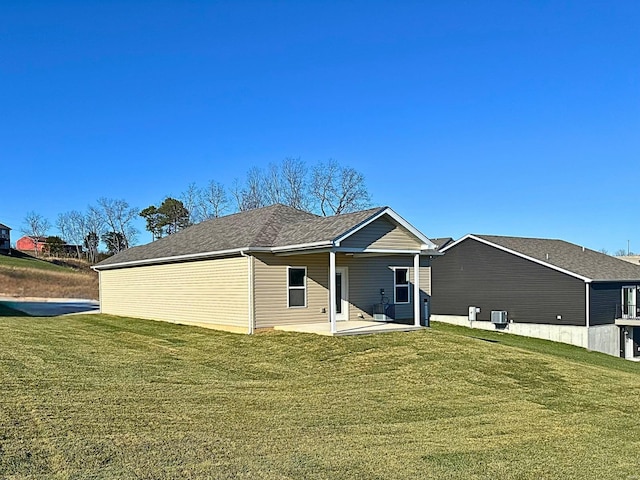 view of front of home with a front lawn and a patio area