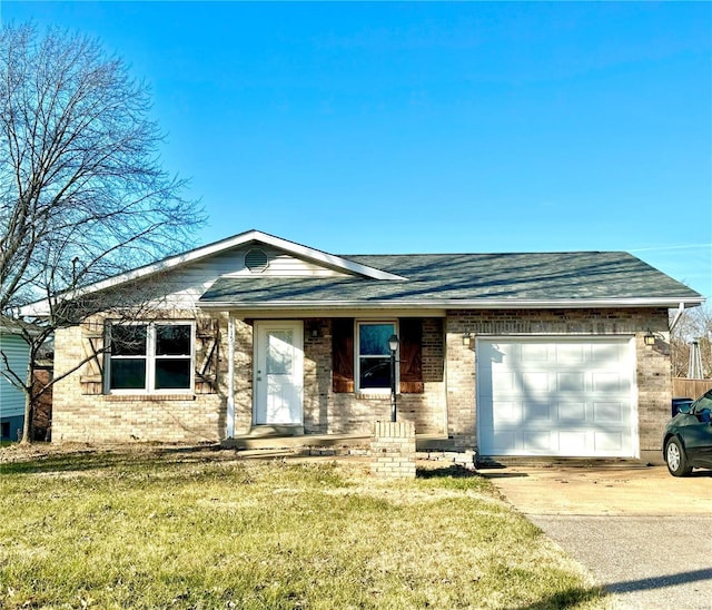 single story home featuring a garage and a front lawn