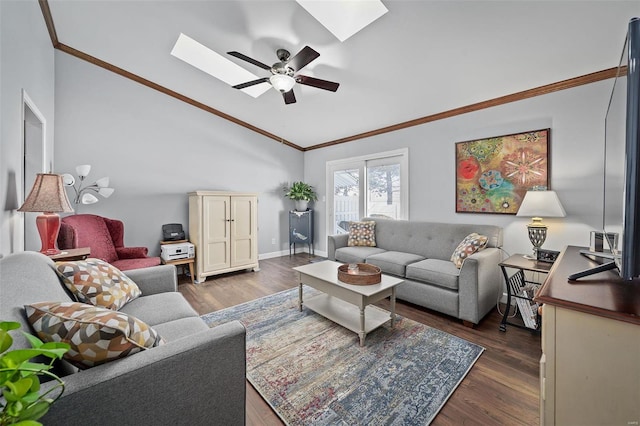 living area featuring a ceiling fan, lofted ceiling with skylight, dark wood-type flooring, and crown molding