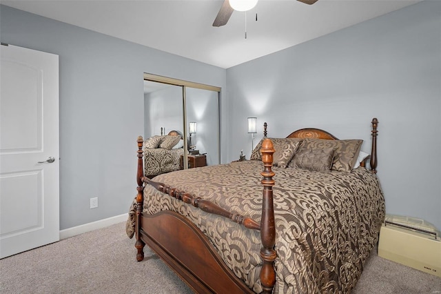 carpeted bedroom featuring a ceiling fan, baseboards, and a closet