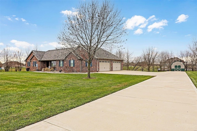 view of front of property featuring a front yard and a garage