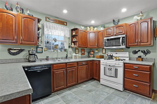 kitchen featuring sink, dishwasher, and white gas range oven