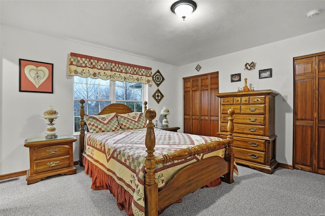 carpeted bedroom with a closet