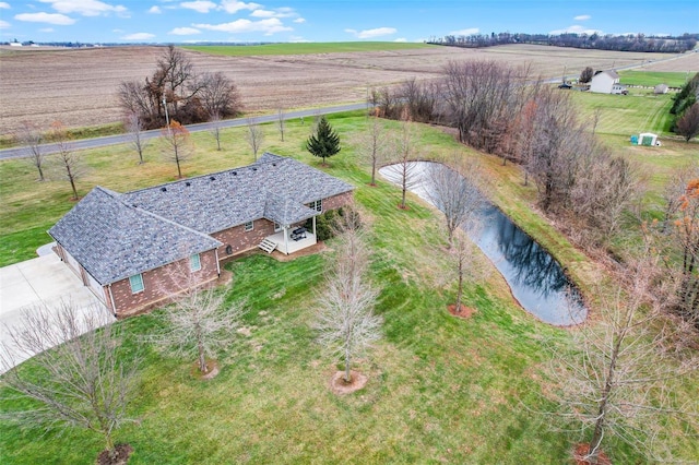 bird's eye view featuring a rural view and a water view