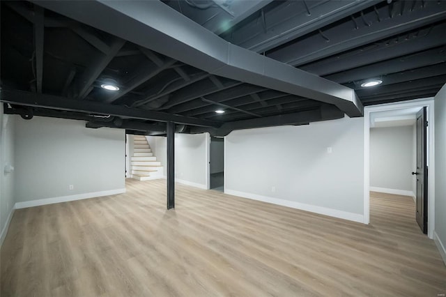 basement featuring light wood-type flooring