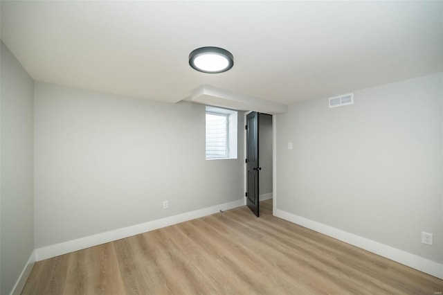 basement featuring light wood-type flooring