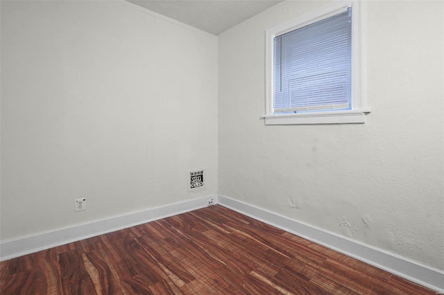 unfurnished room featuring hardwood / wood-style flooring