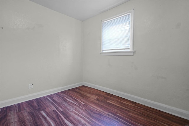 spare room with wood-type flooring