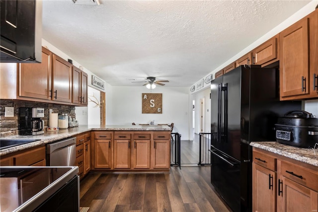 kitchen with brown cabinets, dishwasher, and a ceiling fan