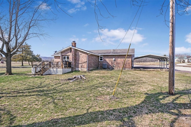 exterior space featuring a wooden deck, brick siding, a carport, and a lawn