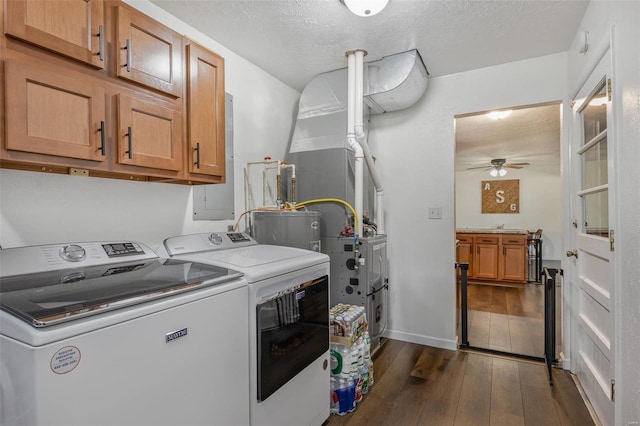 laundry area with a ceiling fan, dark wood finished floors, separate washer and dryer, cabinet space, and a textured ceiling