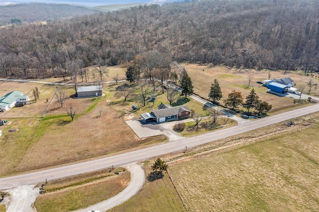 birds eye view of property with a rural view and a view of trees