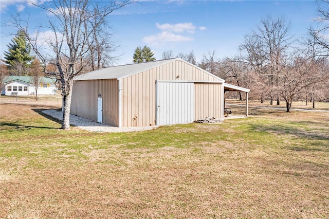view of pole building with a yard