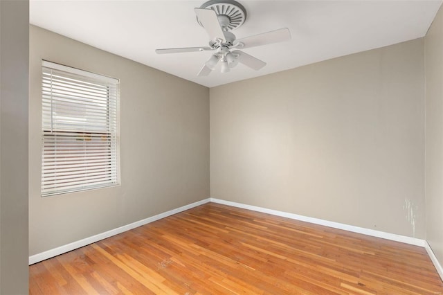 spare room with ceiling fan and light wood-type flooring