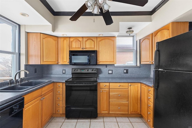 kitchen featuring black appliances, backsplash, light tile patterned floors, and sink