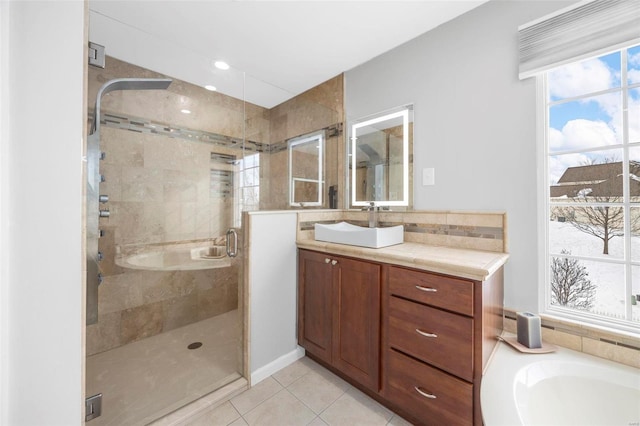 bathroom with tile patterned flooring, decorative backsplash, vanity, and a shower with shower door