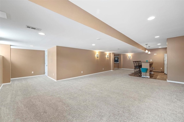 interior space with white fridge and light colored carpet