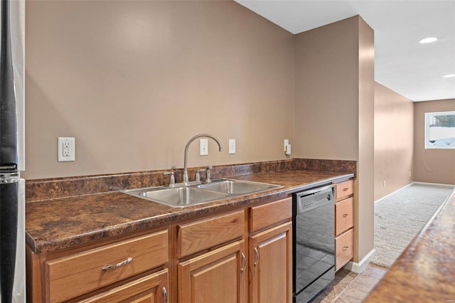 kitchen featuring dishwasher, light colored carpet, and sink