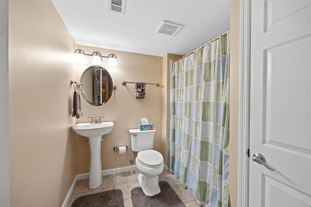 bathroom with toilet and walk in shower