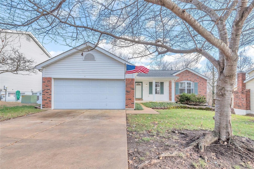 ranch-style home featuring a garage, central air condition unit, and a front yard