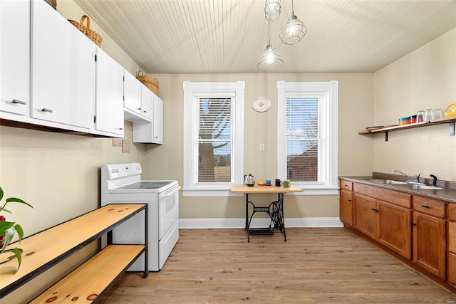 kitchen with white cabinetry, sink, light hardwood / wood-style flooring, stove, and decorative light fixtures