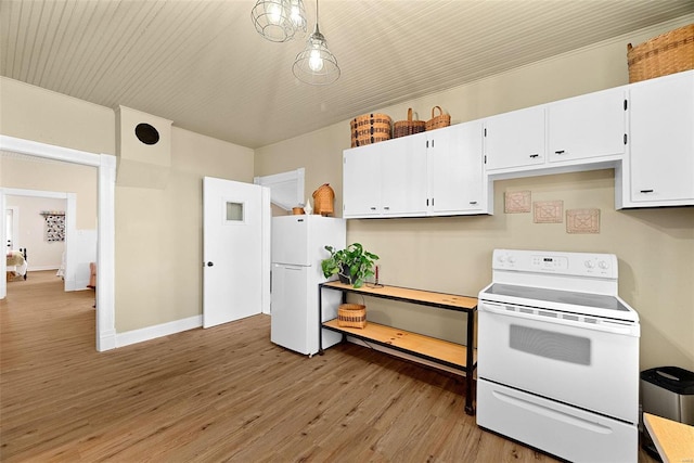 kitchen with white cabinets, white appliances, hanging light fixtures, and light hardwood / wood-style flooring