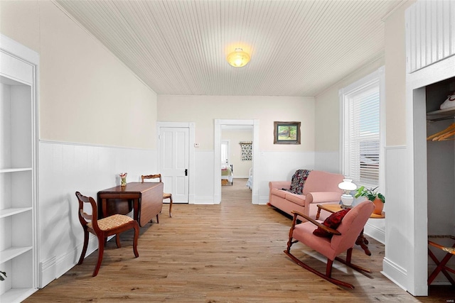 sitting room featuring light hardwood / wood-style floors and built in features