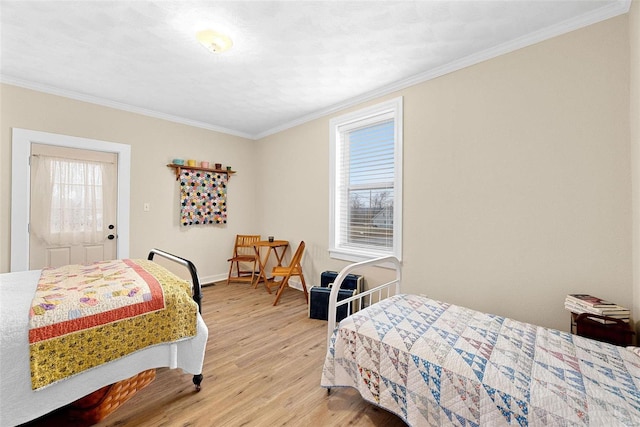 bedroom with wood-type flooring and ornamental molding