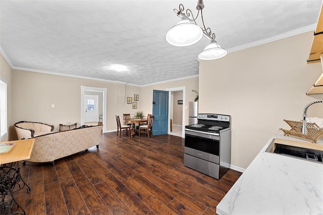 kitchen with appliances with stainless steel finishes, crown molding, sink, dark hardwood / wood-style floors, and hanging light fixtures