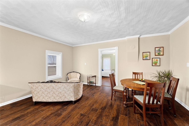 dining space with a textured ceiling, dark hardwood / wood-style flooring, and ornamental molding