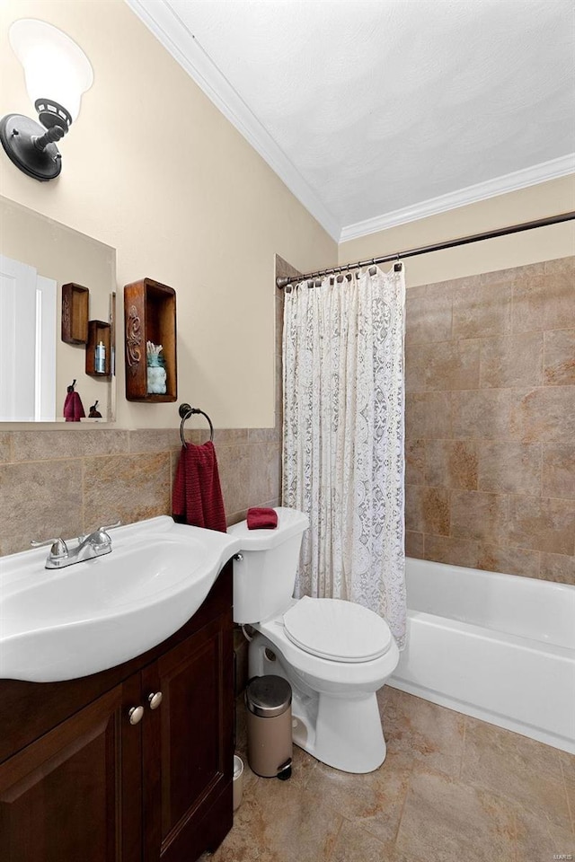 full bathroom with vanity, toilet, crown molding, and shower / tub combo with curtain