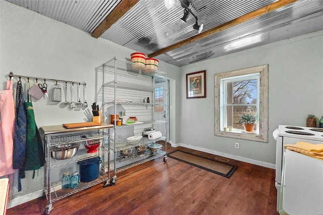 interior space with electric range, beam ceiling, and dark wood-type flooring